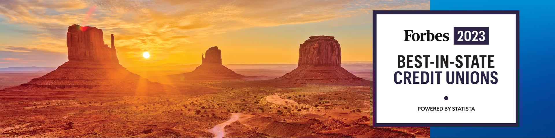 A breathtaking sunset over the Arizona desert mountains, featuring the prestigious 'Forbes 2022 Best-in-State Credit Unions, Powered by Statista' black and white graphic off to the right-hand side within the scenic landscape.